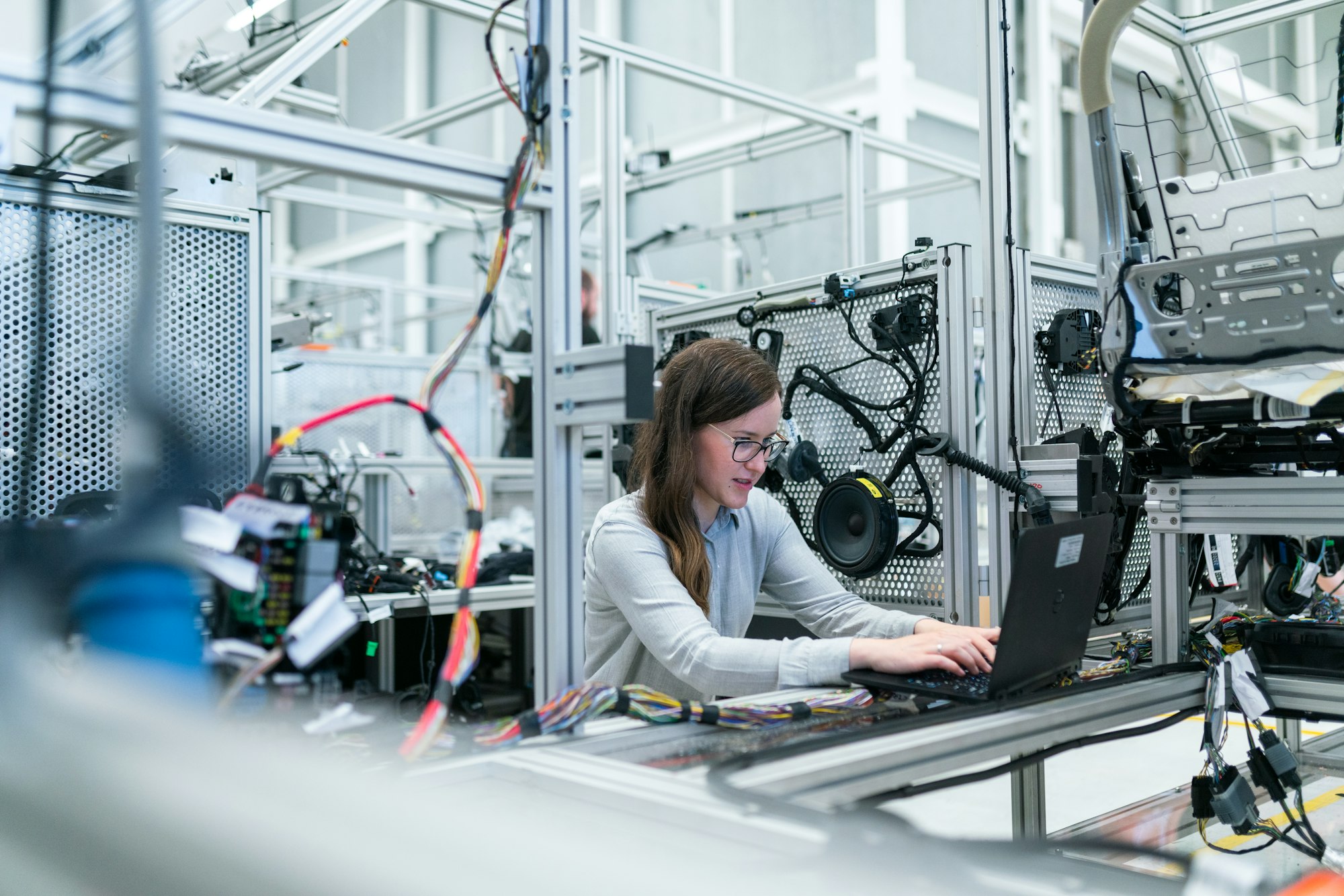 A technician working in a clean, instrumented lab environment.